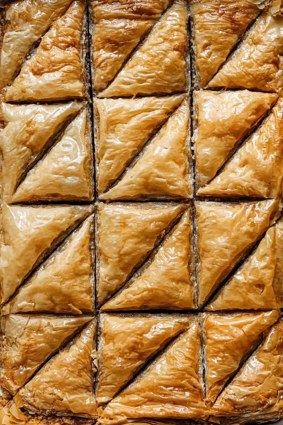 Top down photo of baklava cut into triangles.