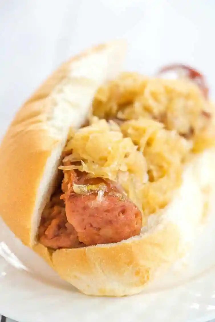 This slow cooker kielbasa and sauerkraut is flavorful and made with just the addition of beer and brown sugar - straightforward, rich and reliable for parties!