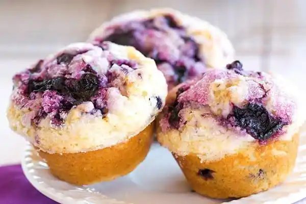 These blueberry muffins are loaded with fresh blueberries, have a fresh blueberry jam swirl throughout and are topped with sugar for a crisp bite!