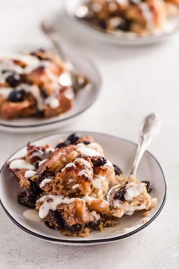Two plates of bread pudding.