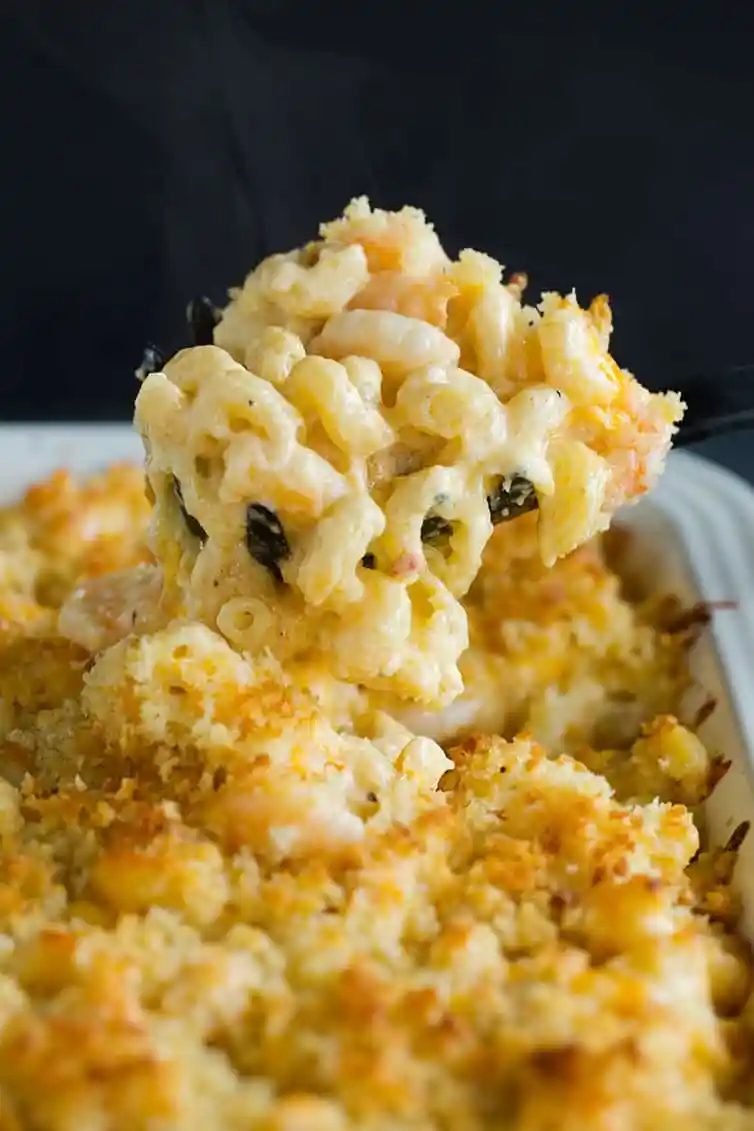Scooping up a big helping of Cajun shrimp macaroni and cheese.