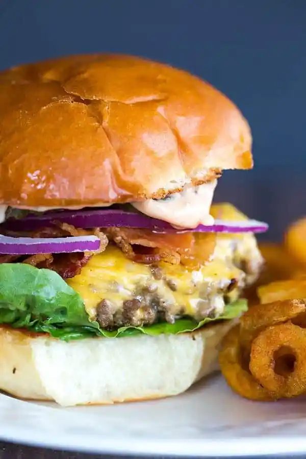Cast Iron Skillet Cheeseburgers - They're tender, flavorful and never dry! You'll never want to make them on the grill again!