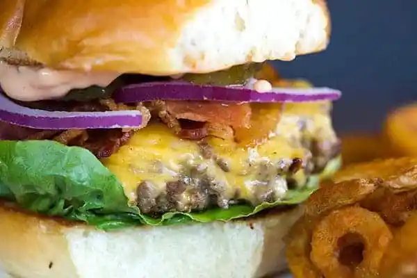Cast Iron Skillet Cheeseburgers - They're tender, flavorful and never dry! You'll never want to make them on the grill again!