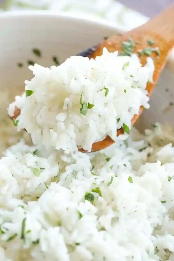 A at-home recipe for Chipotle's popular cilantro-lime rice, with a simple method to ensure light, fluffy rice with no clumps!