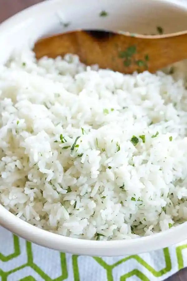 A at-home recipe for Chipotle's popular cilantro-lime rice, with a simple method to ensure light, fluffy rice with no clumps!