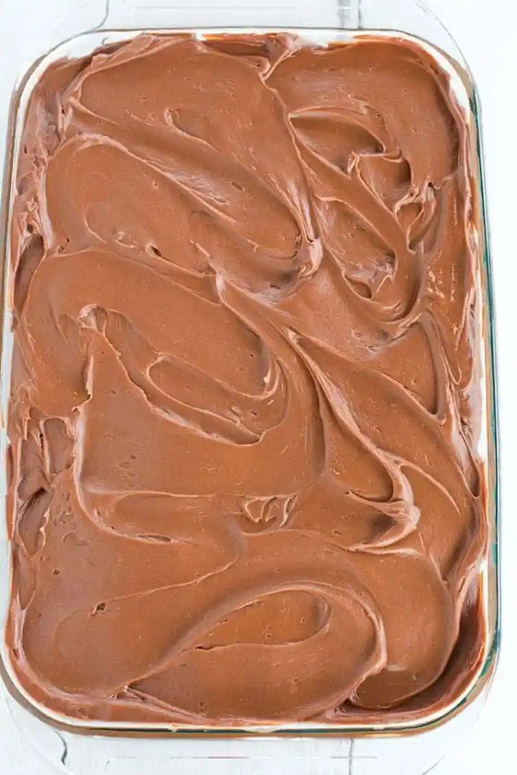 This fabulous chocolate sheet cake only requires one pot for mixing and is topped with the most memorable milk chocolate ganache frosting.