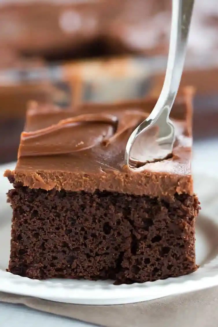 This fabulous chocolate sheet cake only requires one pot for mixing and is topped with the most memorable milk chocolate ganache frosting.