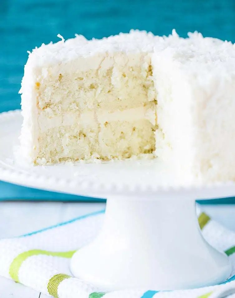 Coconut-Vanilla Bean Cake with Coconut Meringue Buttercream Frosting - A plush coconut-packed layer cake and that frosting is a DREAM!