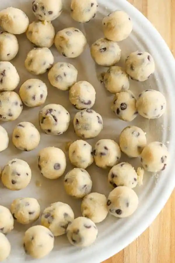 A standby cheesecake recipe loaded with chunks of chocolate chip cookie dough and mini chocolate chips - a cookie dough lover's dream!