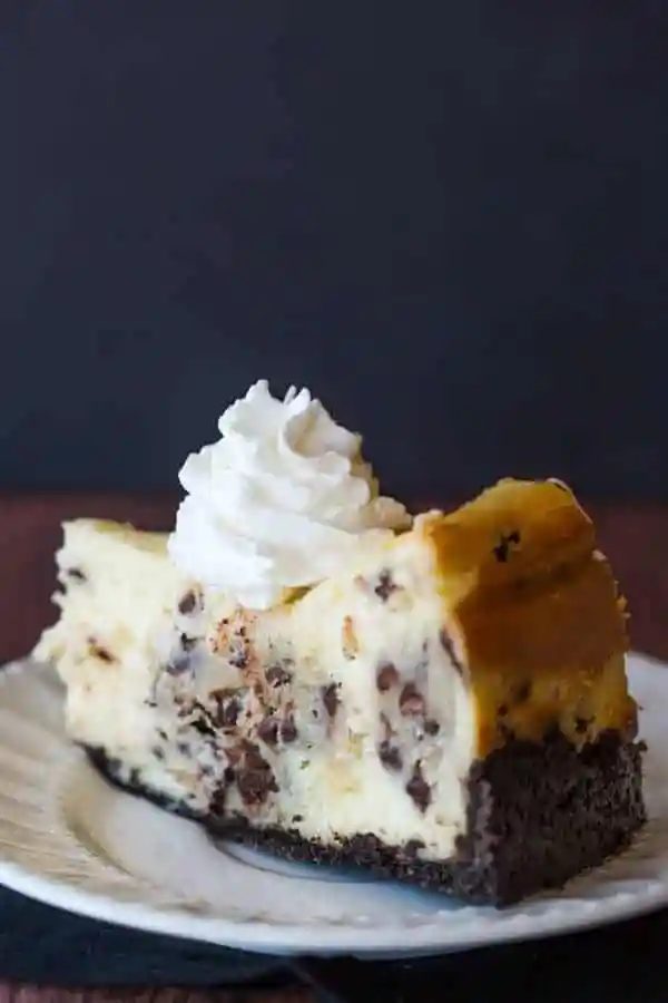 A standby cheesecake recipe loaded with chunks of chocolate chip cookie dough and mini chocolate chips - a cookie dough lover's dream!
