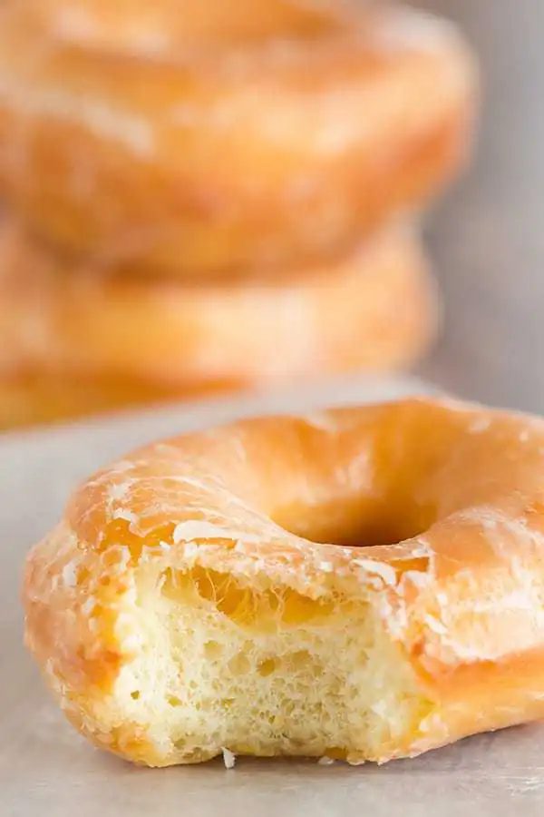 A at-home recipe for Krispy Kreme doughnuts - they're light, airy and covered in a barely-there glaze.