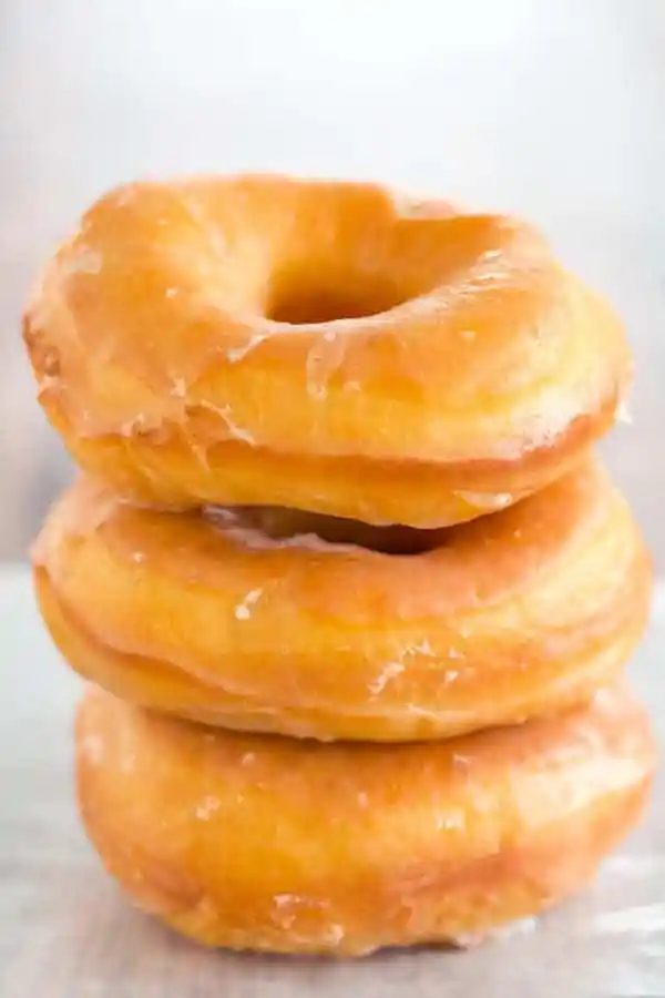 A at-home recipe for Krispy Kreme doughnuts - they're light, airy and covered in a barely-there glaze.