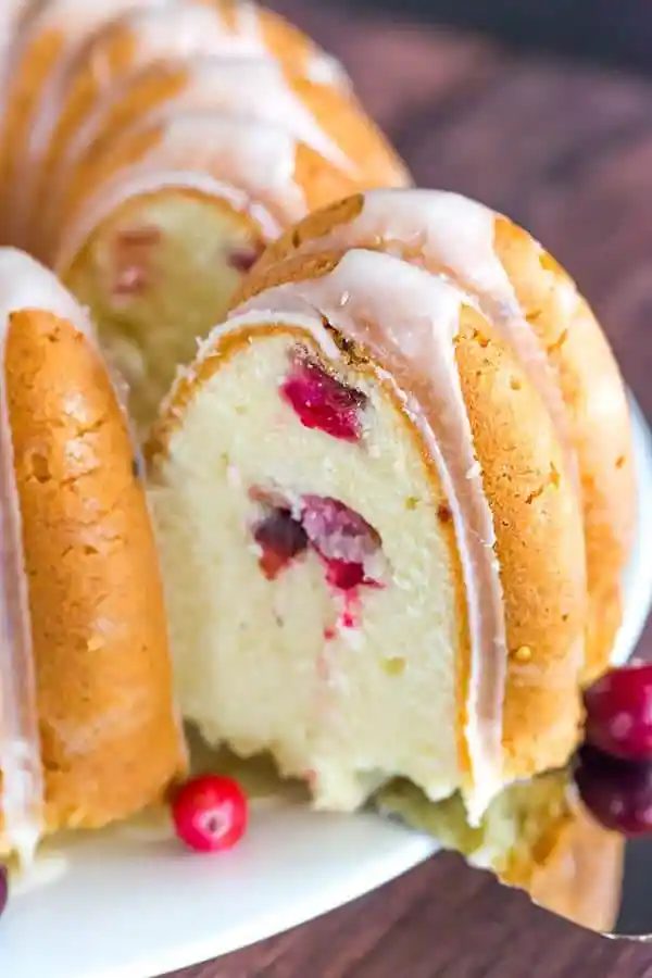 This Cranberry Pound Cake is wonderfully dense, plush and loaded with fresh cranberries. Topped with a simple orange glaze, it's reliable for the holidays.