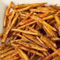 French fries on a white serving platter.