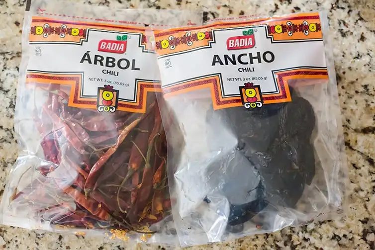 Bags of dried ancho and dried arbol chiles.
