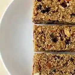 Overhead image of 3 from-scratch granola bars on a white plate.