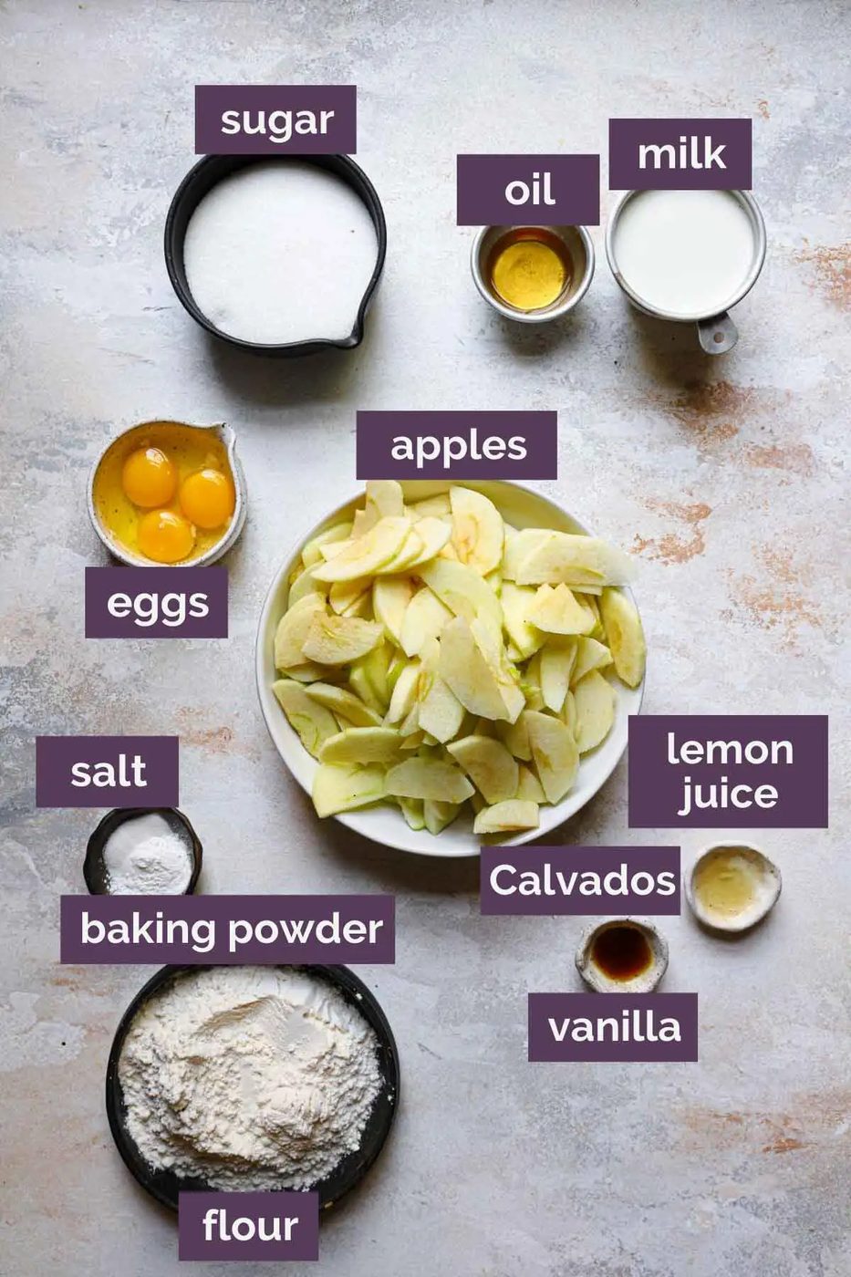 Ingredients for French apple cake prepped and labeled.