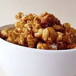 From-scratch Cracker Jack popcorn in a white bowl.