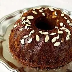 Honey Bundt cake on a silver serving platter.