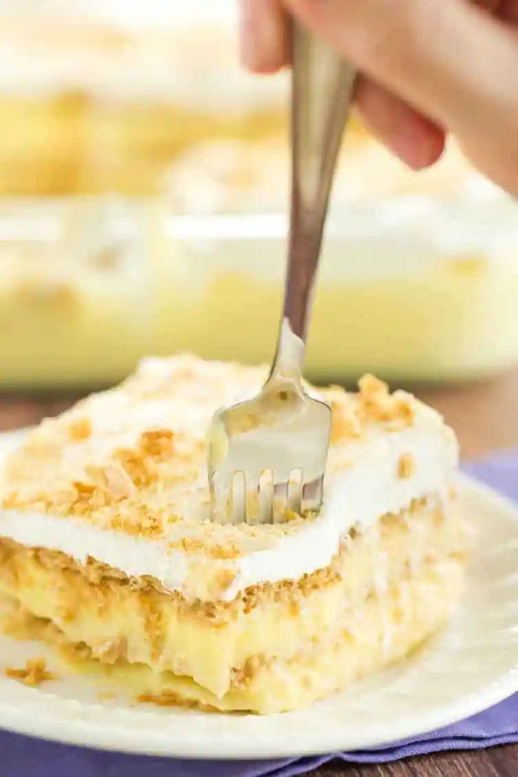 A piece of icebox cake with a fork digging right in!