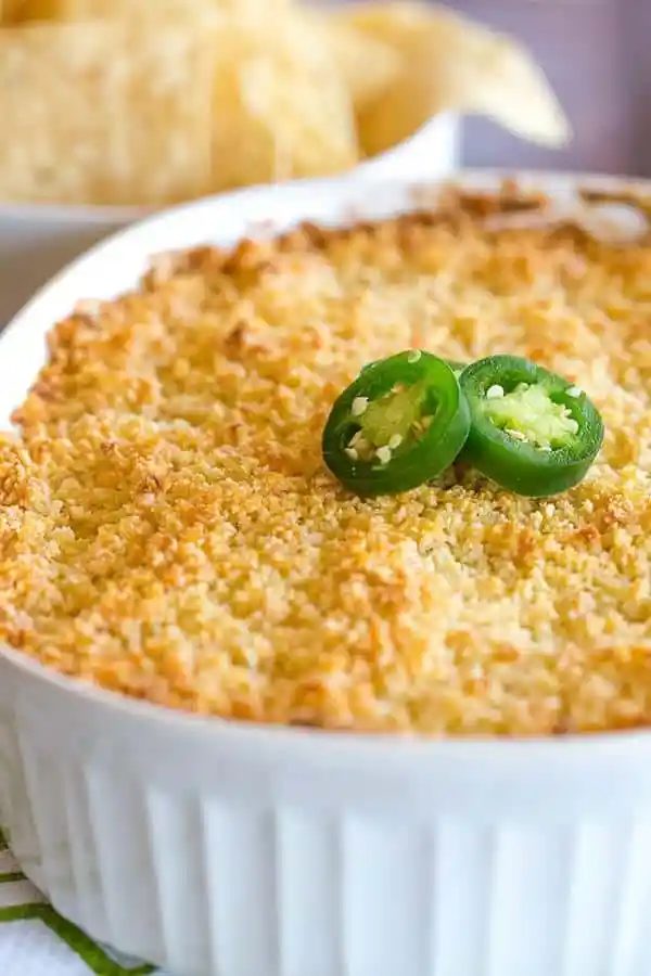 Jalapeno Popper Dip is creamy, cheesy and has just the reliable amount of kick. Great for your next party or watching the big game!