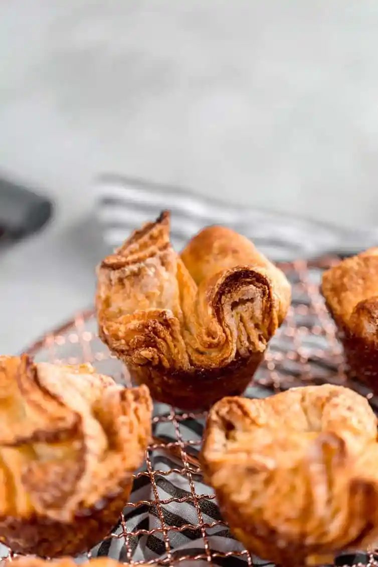 Kouign-Amann pastries on a cooling rack.