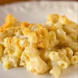 A serving of macaroni and cheese casserole on a white plate.