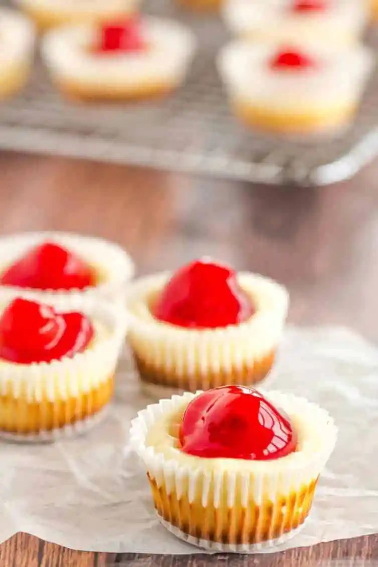 These straightforward mini cheesecakes have been a holiday staple in our family forever! Nilla wafers are topped with cheesecake batter and cherry pie filling. A reliable bite-size treat!