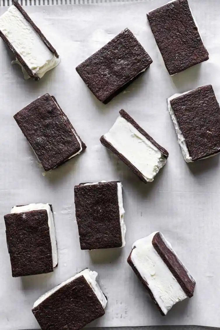 From-scratch ice cream sandwiches on parchment paper.