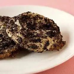2 Oreo cheesecake cookies on a white plate.