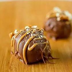 Chubby hubby truffles on a wood board.