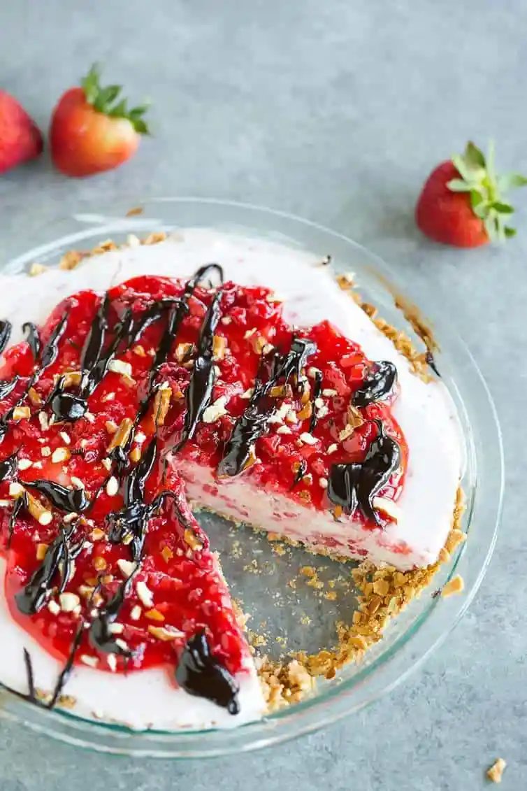 A strawberry-vanilla ice cream pie with a sugar cone and pretzel crust.