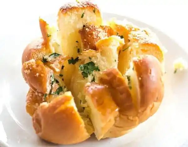 These Straightforward Pull-Apart Garlic Rolls are speedy, a reliable way to use up leftover dinner rolls, and are a fabulous alternative to traditional garlic bread.