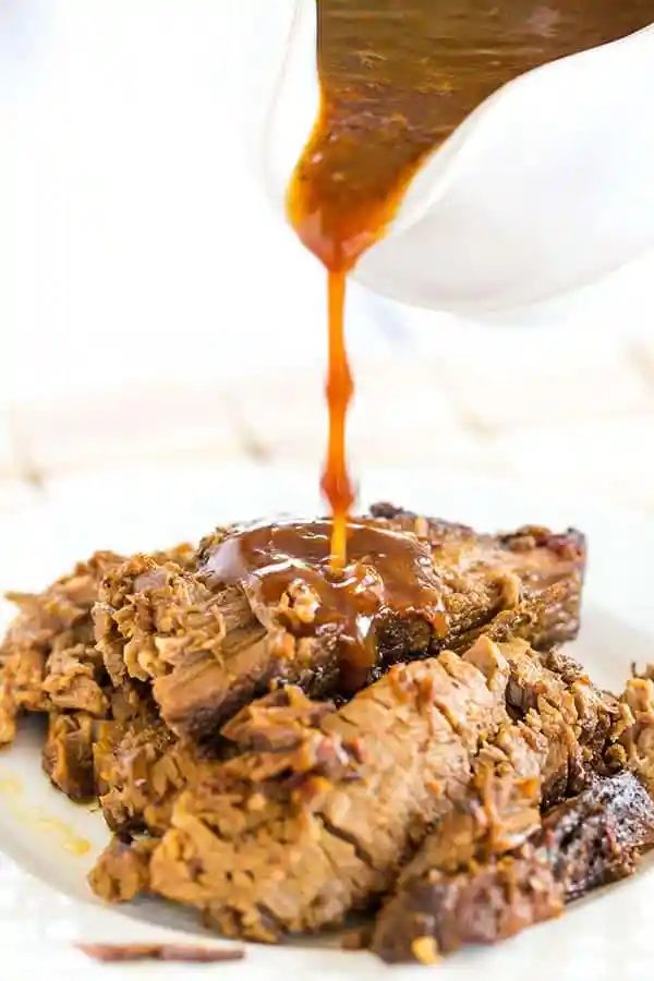 This slow cooker beef brisket is incredibly straightforward, cooks itself, and full of flavor thanks to the simple from-scratch barbecue sauce!