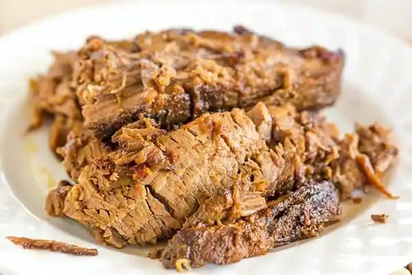 This slow cooker beef brisket is incredibly straightforward, cooks itself, and full of flavor thanks to the simple from-scratch barbecue sauce!
