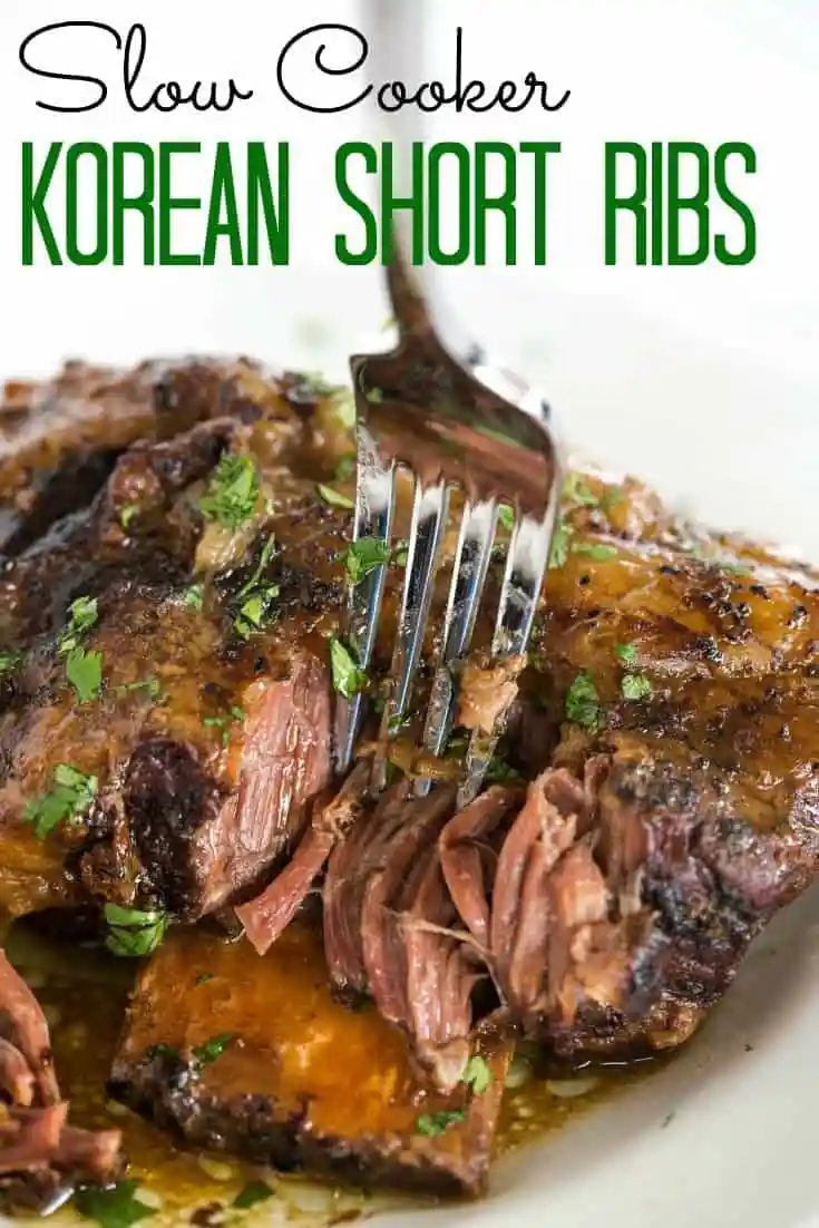 Slow Cooker Korean Short Ribs are A straightforward, set it and forget it meal that is full of memorable flavor and tender, falling apart meat! |