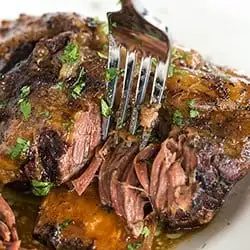 Slow Cooker Korean Short Ribs are A straightforward, set it and forget it meal that is full of memorable flavor and tender, falling apart meat! |
