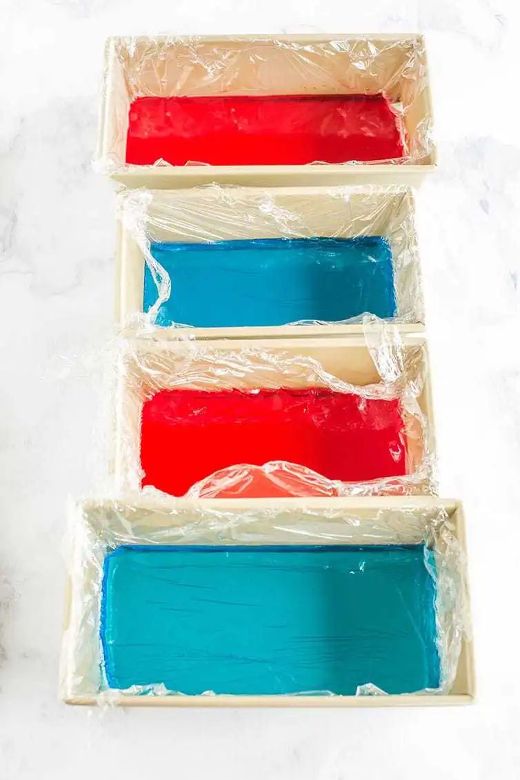 Red and blue Jello prepped in loaf pans for red, white & blue stained glass Jello stars.