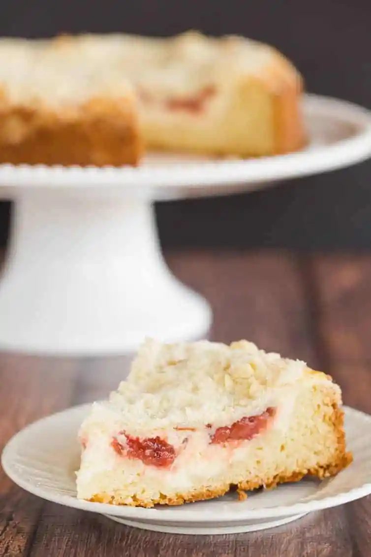 Strawberry Rhubarb Coffee Cake - A biscuit-like cake topped with a cream cheese filling and from-scratch strawberry rhubarb jam.
