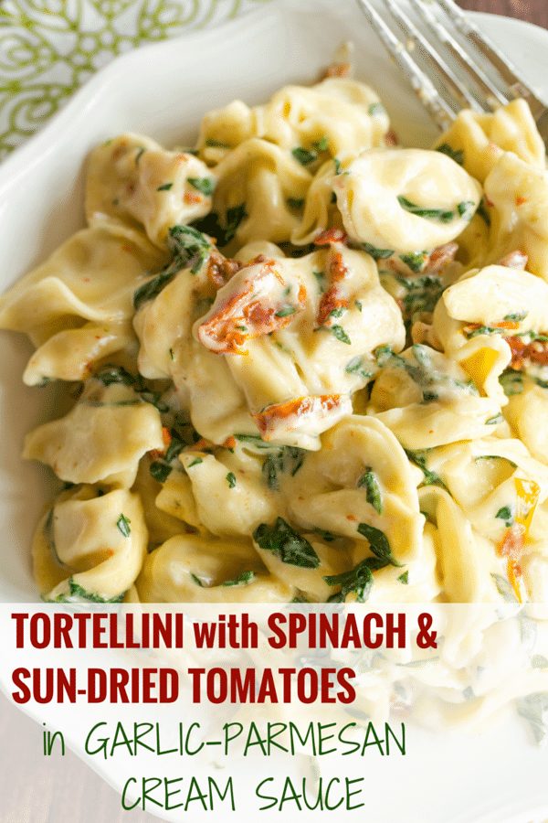 Tortellini in Parmesan-Cream Sauce with Spinach and Sun-Dried Tomatoes - A straightforward, AMAZING dinner ready in less than 30 minutes! Reliable for a weeknight meal or your next dinner party.