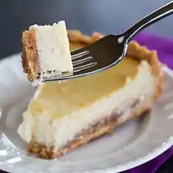 Hidden Berry Cream Cheese Torte - A luscious cream cheese filling sits atop a shortbread crust and a layer of strawberry jam. |