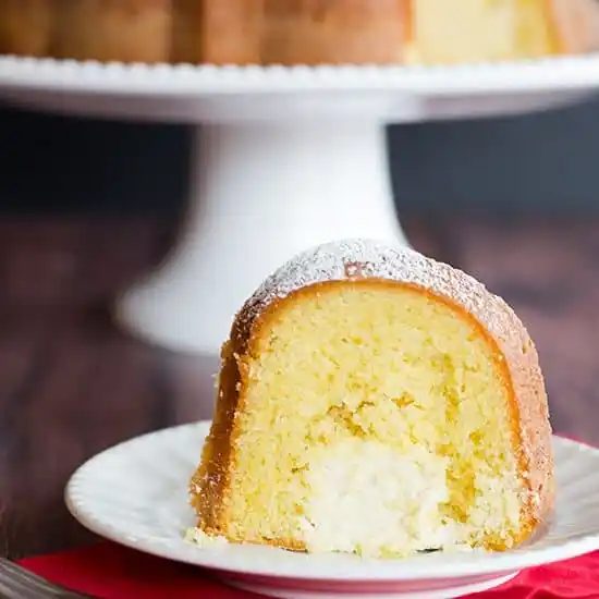 Twinkie Bundt Cake - This from-scratch Bundt version of the popular Twinkie dessert features a vanilla pound cake with a tunnel of that glorious cream filling!