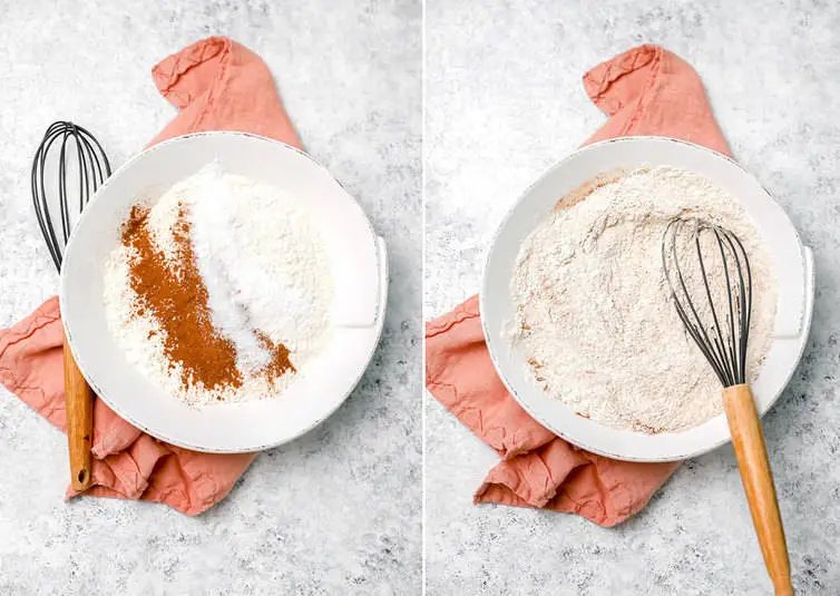 Whisking together dry ingredients in a bowl for zucchini bread.