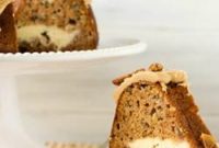 Heavenly Apple Bundt Cake with Cream Cheese Swirl and Praline Drizzle