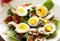 Warm Spinach Bliss with Crispy Bacon Sautéed Mushrooms and Eggs