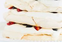 Decadent Pavlova Layer Cake with Whipped Cream and Berries