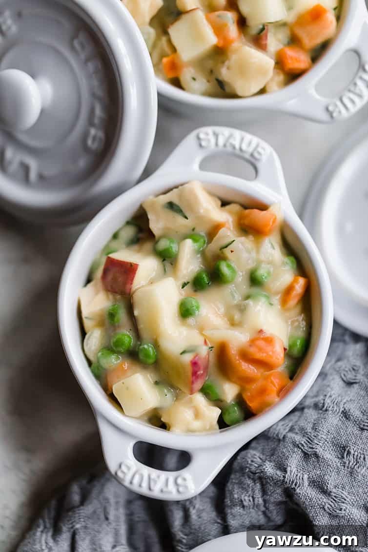 Chicken pot pie filling in a ramekin.