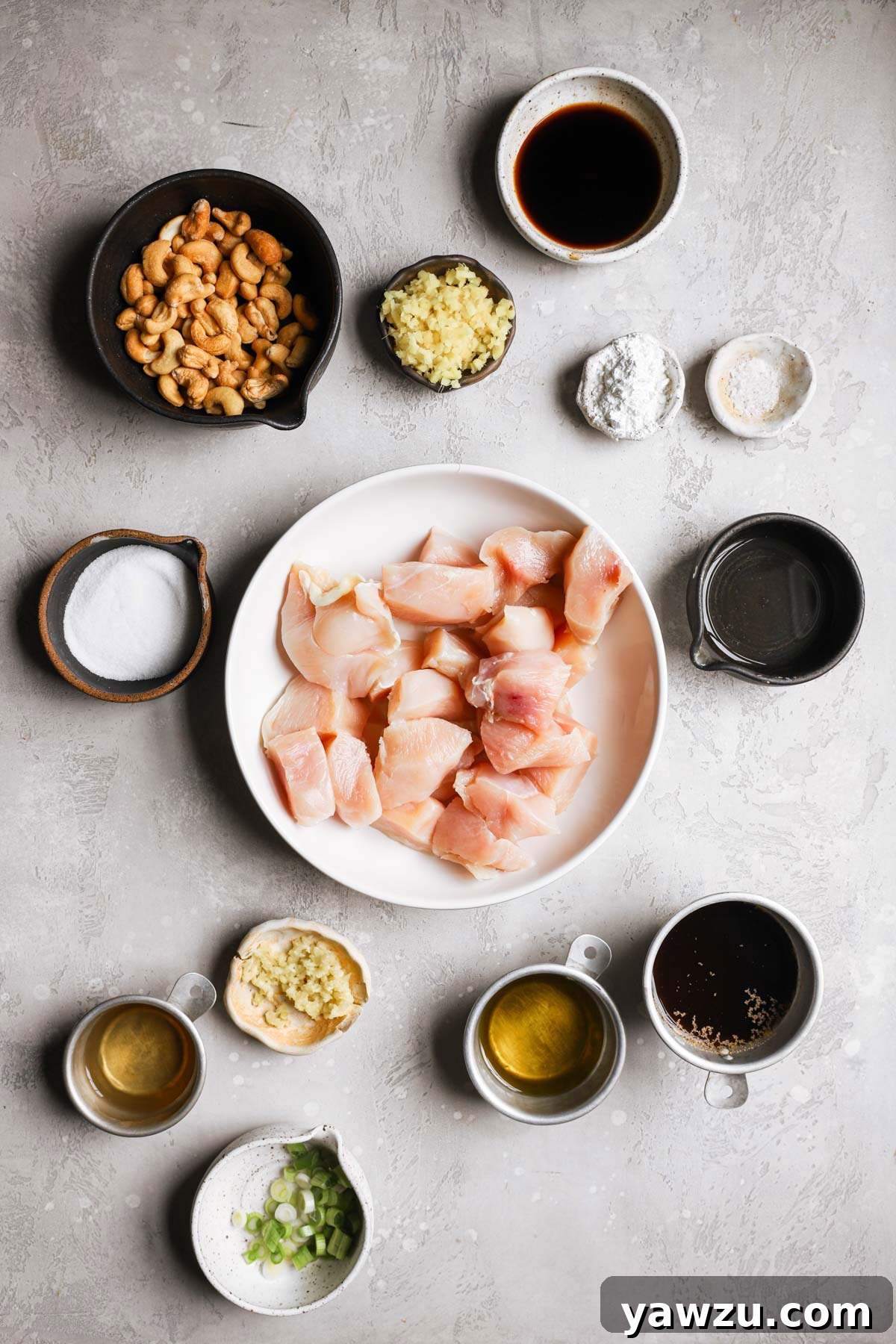Ingredients for chicken with cashew nuts prepped on a counter.