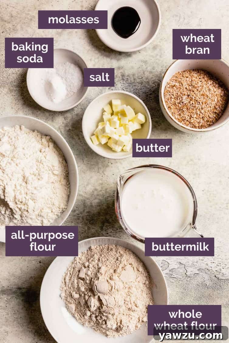 The ingredients for Irish brown bread in bowls on a counter labeled with that each ingredient is.