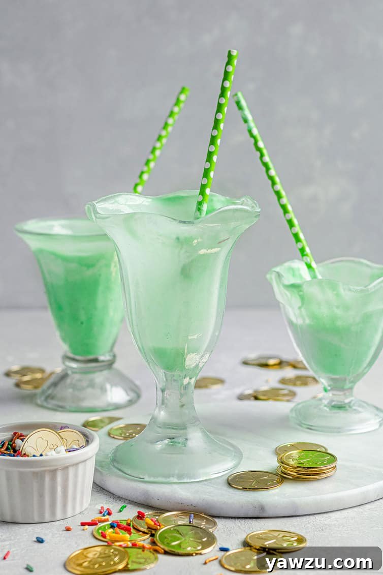 Three empty milkshake glasses, clean and ready for serving delicious shakes.